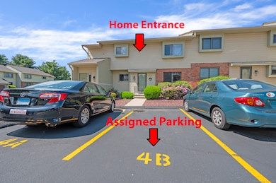 Front entrance and assigned parking spot