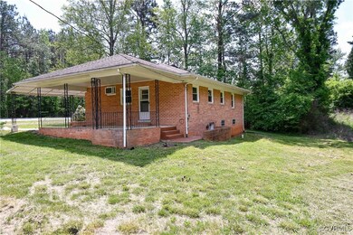 View of front of home featuring covered porch, a f