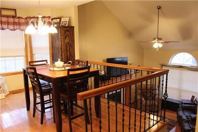 Dining area overlooking the living room with vault