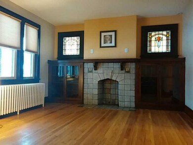 Living Room. Elegant hardwood floors, stained glas