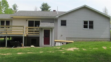 Rear of home - spacious deck is...