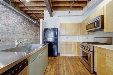 Kitchen featuring stainless steel countertops, ap