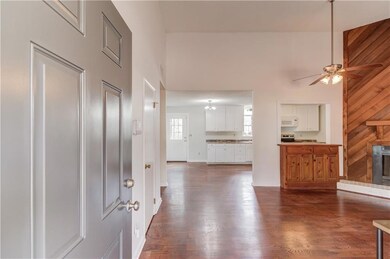 Entryway featuring dark wood-type flooring, a high