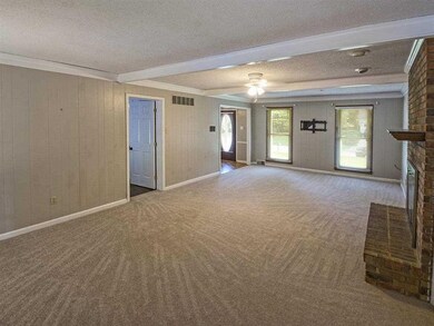 Great room w/ wood burning fireplace, brand new ca