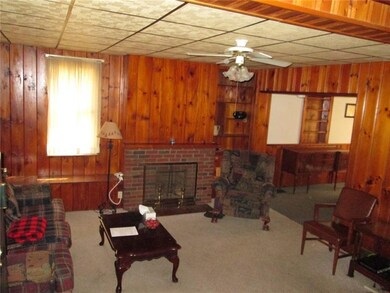 Another view of the 18x15 living room with firepla