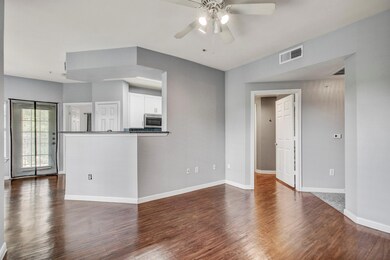 Unfurnished living room featuring a ceiling fan, 