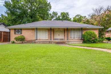 Ranch-style house with a front lawn