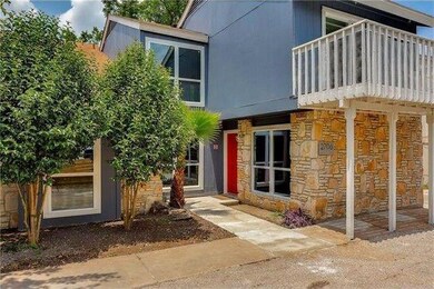 View of front facade featuring stone siding and a
