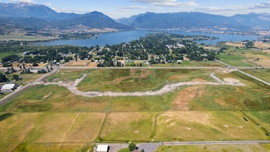 Aerial view of property's location featuring a water and mountain view