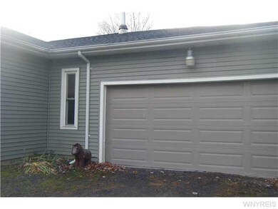 Exterior Front. Attached 1.5 car garage