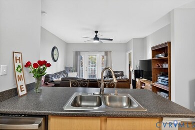 Kitchen view of living room and balcony.