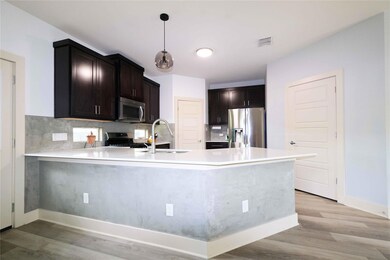 Kitchen featuring appliances with stainless steel