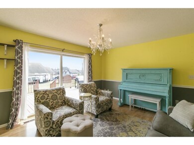 Living room with sliders to deck.
