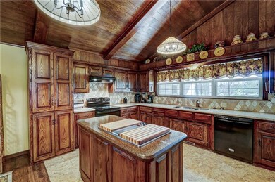 Kitchen features granite countertops, center islan