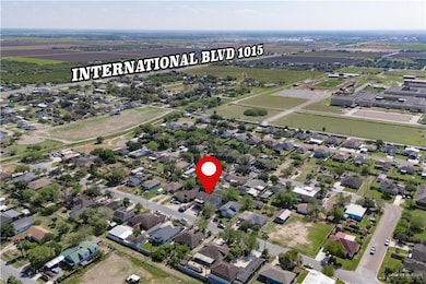 Aerial view of property's location featuring nearby suburban area