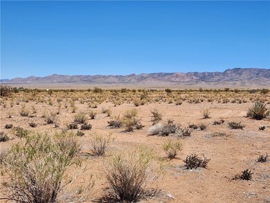 View of mountain background featuring a desert lan