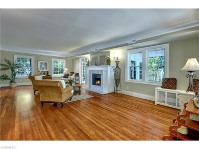 Light and spacious living room with warm hardwood 