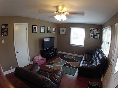 Living Room. Ceiling fan, new windows, interior do