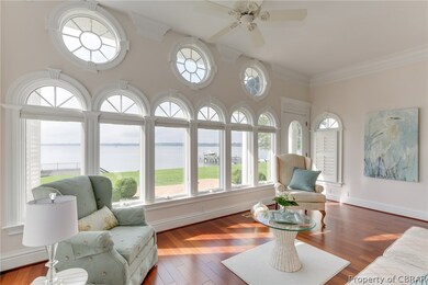 Waterfront living room - wall of windows, with cus