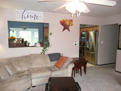 Living room with pass through to kitchen.  New thermostat.