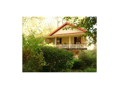 Back of Home With Porch Across the Entire Back of 
