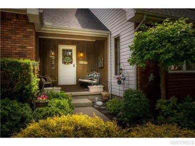 Exterior Front. Welcoming recessed porch for shady
