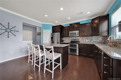Granite counters, SS appliances and breakfast bar.