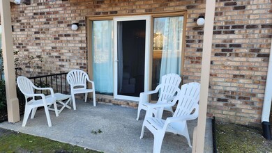 Property entrance featuring a patio area
