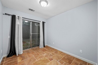 Spare room featuring tile flooring