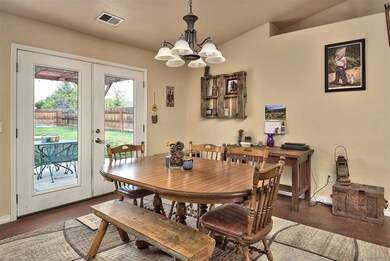 French doors lead from the dining area out to the 