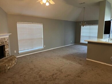 Unfurnished living room featuring visible vents, c