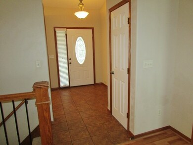 In addition to the tiled front foyer, it also has 