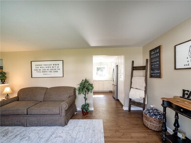 Formal living room entering into new kitchen with 