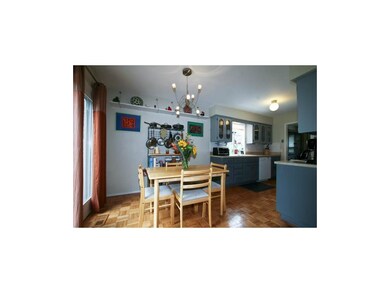 Wood floor in breakfast room and kitchen