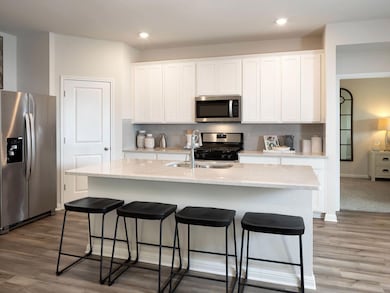 Kitchen with stainless steel appliances, a sink, 