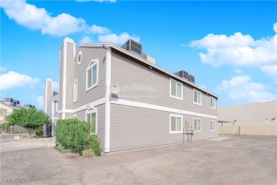 Rear view of property featuring a chimney