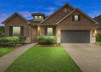 A charming brick home with a well-maintained lawn,