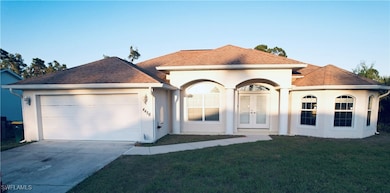 View of front of home with stucco siding, a front