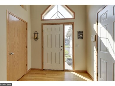 Natural light and warm wood tones make the entry w