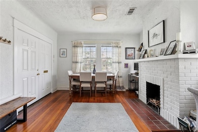 Dining room with fireplace mantel.