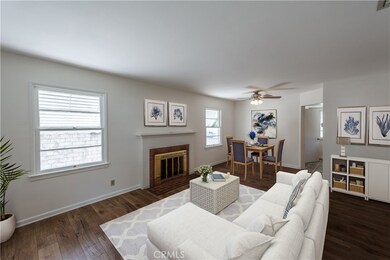 virtually staged living room and dining room combo photo