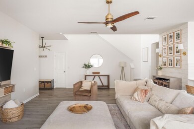 Living room with visible vents, baseboards, ceili