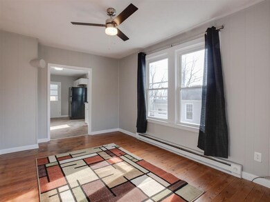 The living room of this home contains hardwood flo