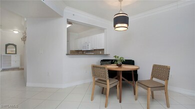 Dining area featuring ornamental molding and baseb