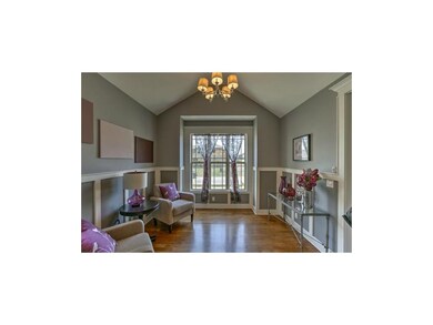 Custom wall rails highlight the front room..office