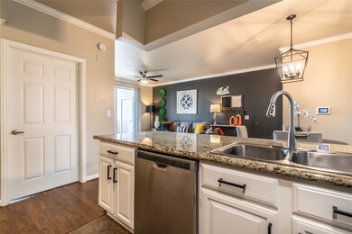 The kitchen seamlessly connects to the dining and living areas.