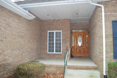 Front covered Porch just begging for a couple of Rocking chairs to go out and have your morning coffee