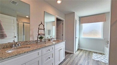 Bathroom featuring wood finished floors, visible v