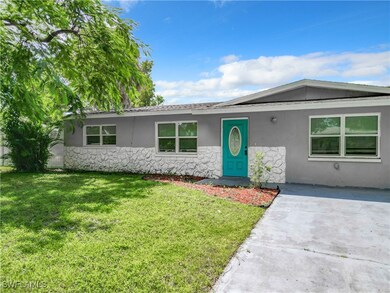 Ranch-style house with a front lawn