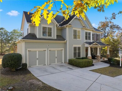 Craftsman house featuring a garage, concrete driveway, covered porch, and board and batten siding
